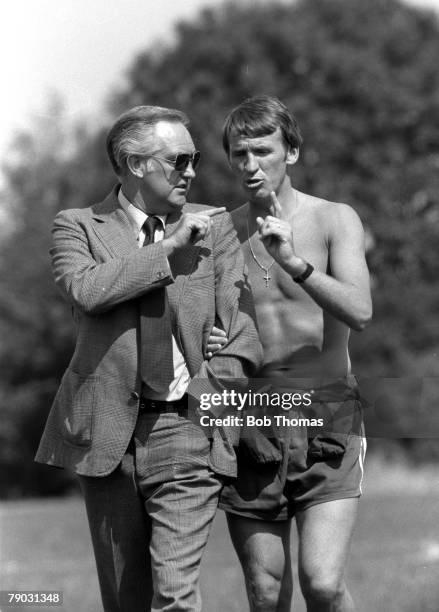 Football Northampton Town FC Manager Pat Crerand is pictured in conversation with the club secretary Dave Bowen during a pre-season session