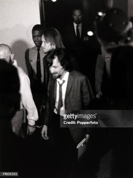 Los Angeles, USA, 25th January 1971, American cult leader Charles Manson is led in handcuffs into a courtroom to stand trial during the "Manson...