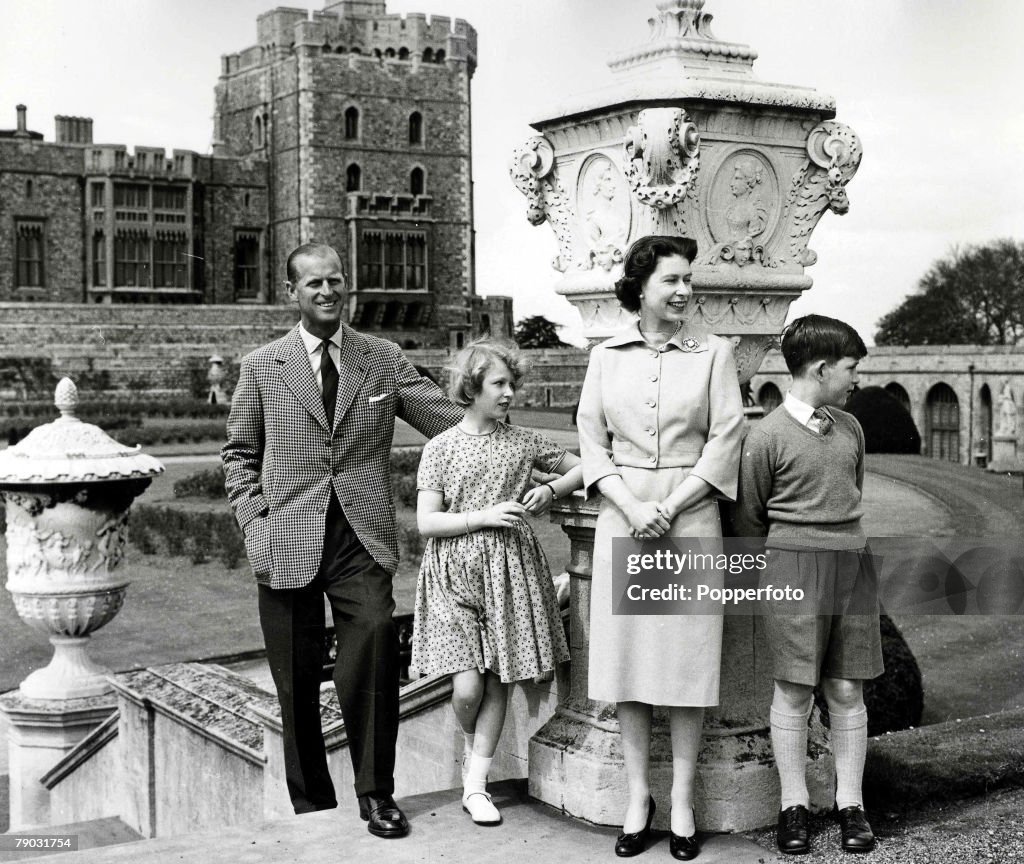 6th June 1959. A picture of the Royal family on top of the East Terrace Garden stops with the Brunswick Tower in the background, at the Royal retreat Windsor Castle. L-R: Prince Philip, Princess Anne, HRH Queen Elizabeth II, and Prince Charles.