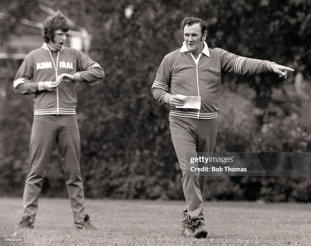 Football. 1976. England manager Don Revie takes charge of an England training session as Mike Channon yawns in the background.