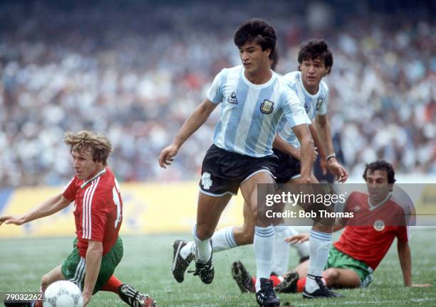 World Cup Finals, Mexico City, Mexico, 10th June Argentina 2 v Bulgaria 0, Argentina's Claudio Borghi is challenged for the ball by Bulgaria's...