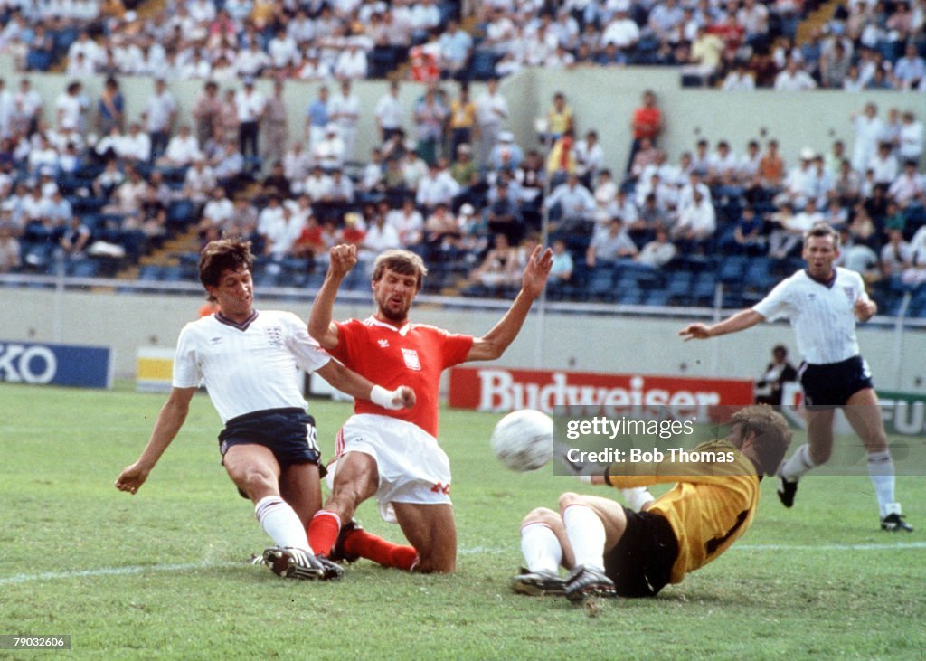1986 World Cup Finals. Monterrey, Mexico. 11th June, 1986. England 3 v Poland 0. England's Gary Lineker slides the ball past Polish goalkeeper Jozef Mlynarczyk to score the first of his three goals.