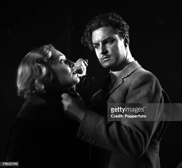 Picture taken from the classic Alfred Hitchcock film "The 39 Steps", In the scene pictured, actor Robert Donat is seen grabbing actress Madeleine...