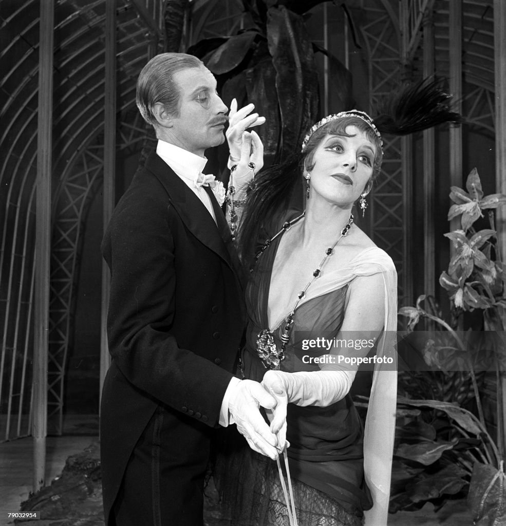 England. 1950. British actor Richard Wattis and actress Marjorie Stewart are pictured dancing an Edwardian-style tango in a scene from the play "Ring Round the Moon".