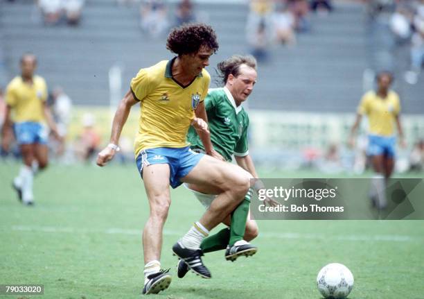 World Cup Finals, Guadalajara, Mexico, 12th June Brazil 3 v Northern Ireland 0, Brazil's Casagrande battles for the ball with Northern Ireland's...