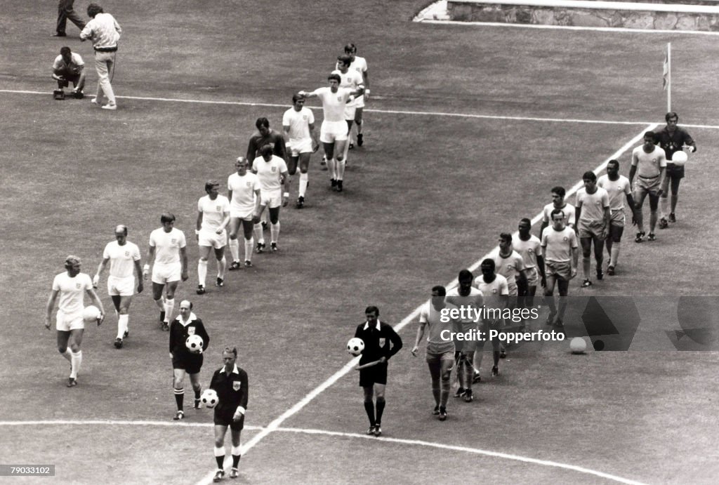 Sport. Football. 1970 World Cup Finals. Guadalajara, Mexico. 7th June 1970. Group 3. England 0 v Brazil 1. The two teams walk onto the pitch together, England led by captain Bobby Moore and Brazil by their skipper Carlos Alberto.