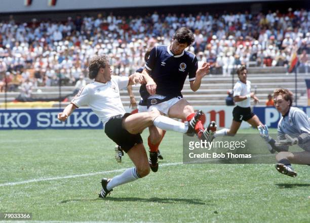 World Cup Finals, Queretaro, Mexico, 8th June West Germany 2 v Scotland 1, West Germany's Rudi Voeller clashes with Scotland's David Narey