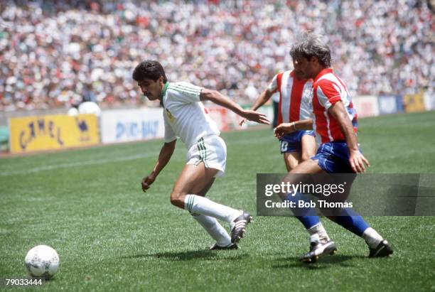 World Cup Finals, Azteca Stadium, Mexico, 7th June Mexico 1 v Paraguay 1, Mexico's Luis Flores is challenged for the ball by Paraguay's Jose Amado...