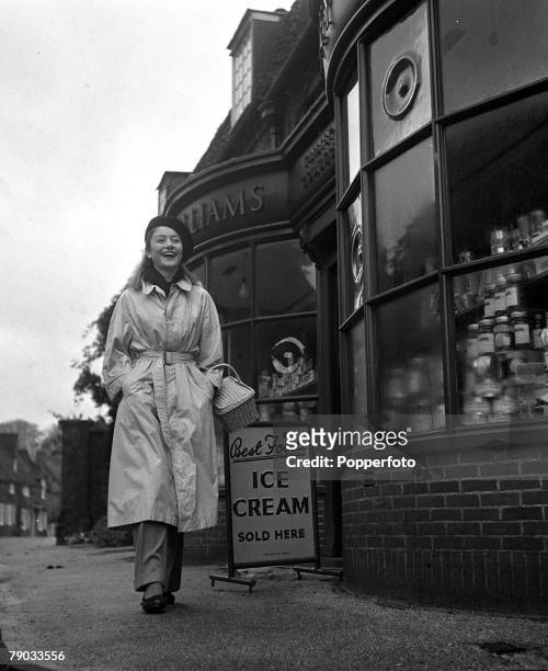 Denham Village, England 17 year old French actress Anouk Aimee who is in England to act in the film "Golden Salamander" is pictured shopping