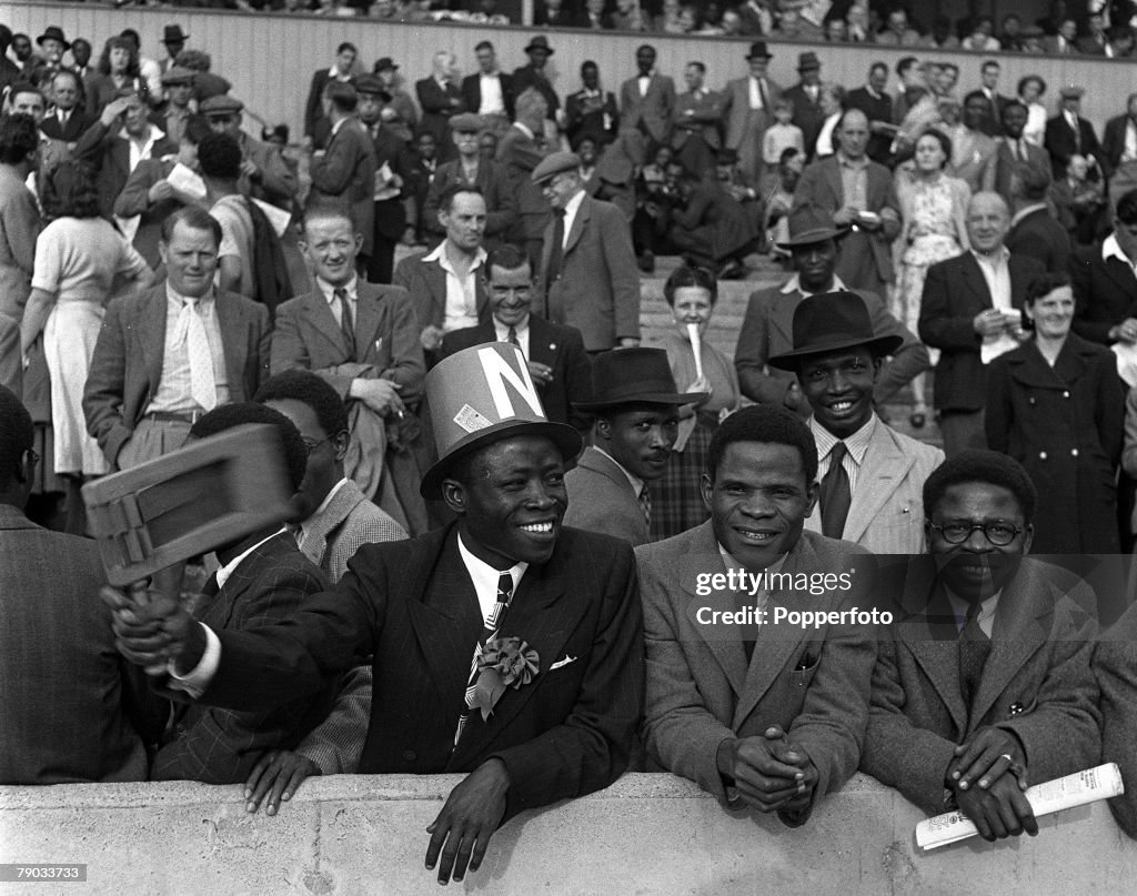 Sport. Football. England. 1949. Supporters for the Nigeria football team who are playing in England for the first time are pictured enjoying a match.