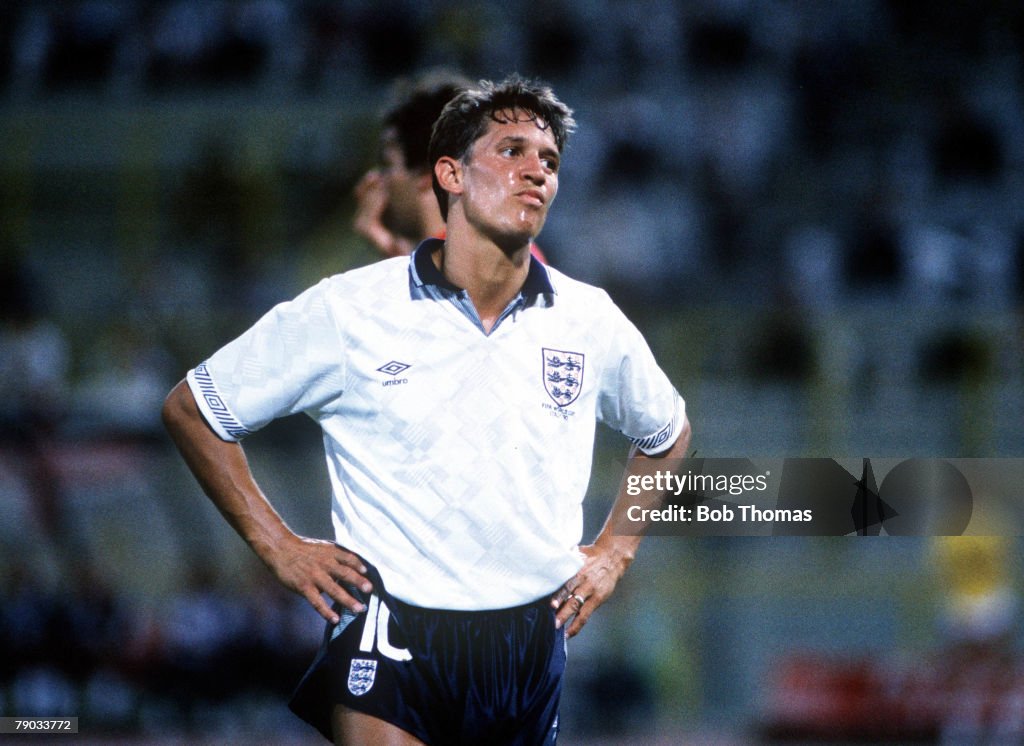 1990 World Cup Finals. Second Phase. Bologna, Italy. 26th June, 1990. England 1 v Belgium 0 (after extra time). England striker Gary Lineker looks annoyed as he stands hands on hips.