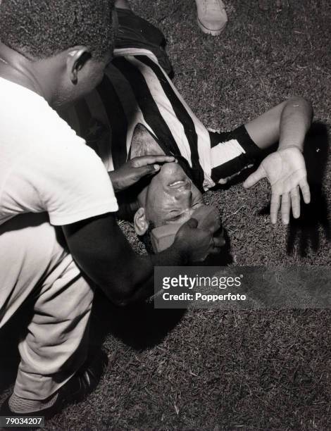 Sport, Football in South America, circa 1962, Botafogo's Garrincha receives attention as the wet sponge is administered, He played 60 times for...