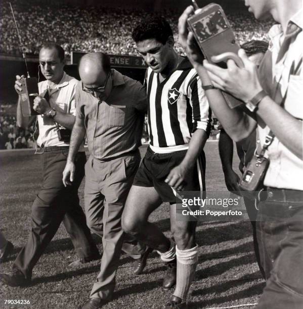 Sport, Football in South America, April 1964, Botafogo's Garrincha moves awkwardly after injuring himself in a club match, He played 60 times for...