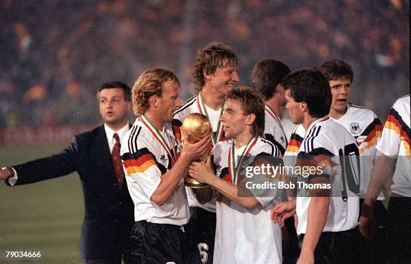 1990 World Cup Final. Rome, Italy. 8th July, 1990. West Germany 1 v Argentina 0. West Germany's Thomas Hassler holds the World Cup trophy with Andreas Brehme after the presentation. 1990 World Cup Final. Rome, Italy. 8th July, 1990. West Germany 1 v Argentina 0. West Germany's Thomas Hassler holds the World Cup trophy with Andreas Brehme after the presentation.