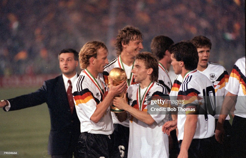 1990 World Cup Final. Rome, Italy. 8th July, 1990. West Germany 1 v Argentina 0. West Germany's Thomas Hassler holds the World Cup trophy with Andreas Brehme after the presentation.