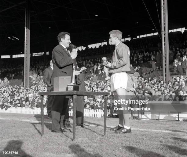 Football, Manchester United's Denis Law receives the European Footballer of the Year award for 1964