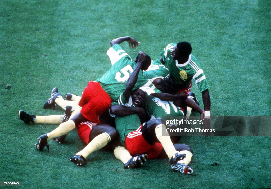 1990 World Cup Finals. Milan, Italy. 8th June, 1990. Argentina 0 v Cameroon 1. Cameroon players pile on top of each other as they celebrate the only goal scored by Omam Biyick.