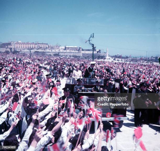 Royal Tour of Malta, Floriana Granares, May 1954, Queen Elizabeth II and the Duke of Edinburgh in a Land Rover acknowledge the cheers of Maltese...