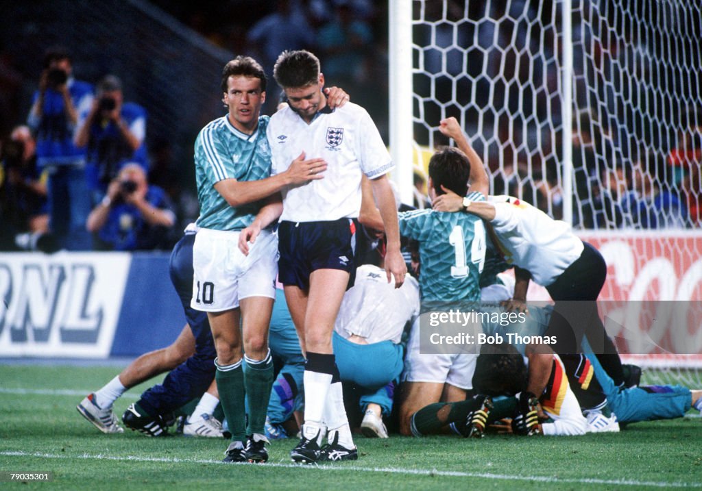 1990 World Cup Semi Final. Turin, Italy. 4th July, 1990. West Germany 1 v England 1. aet. (West Germany win 4-3 on penalties). England's Chris Waddle is consoled by West German captain Lothar Matthaus after his miss in the penalty shoot out won the match 
