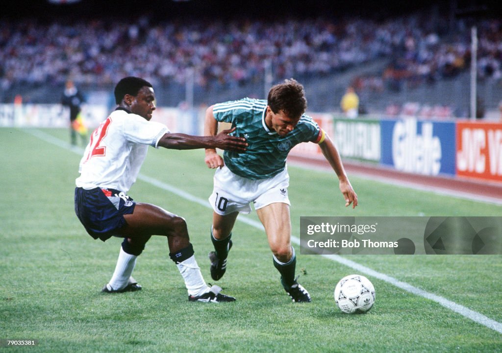 1990 World Cup Semi Final. Turin, Italy. 4th July, 1990. West Germany 1 v England 1 (West Germany win 4-3 on penalties). West Germany's Lothar Matthaus moves past England's Paul Parker with the ball.