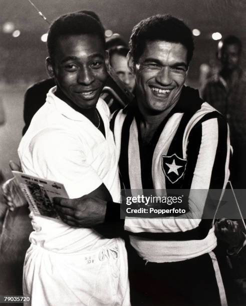 Sport, Football, August 1963, Famous Brazilian stars Pele and Garrincha pictured together as friendly rivals at club level, Pele in his Santos strip...