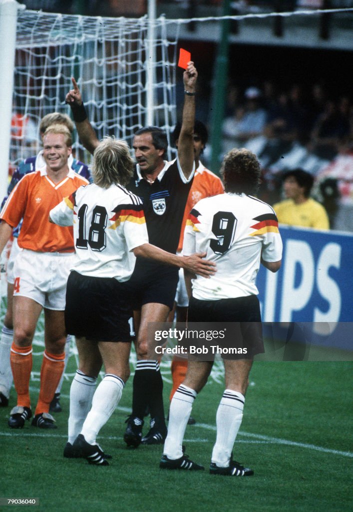 1990 World Cup Finals. Second Phase. Milan, Italy. 24th June, 1990. West Germany 2 v Holland 1. West Germany's Rudi Voeller(9) and Frnk Rijkaard are sent off by referee J.C. Lostan of Argentina after a clash in the Dutch goalmouth. The two were involved i