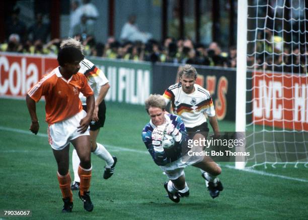 World Cup Finals, Second Phase, Milan, Italy, 24th June West Germany 2 v Holland 1, Dutch goalkeeper Hans Van Breukelen hangs on to the ball under...