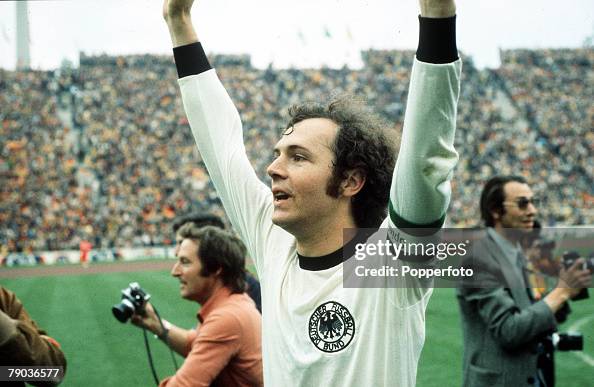 1974 World Cup Final. Munich, West Germany. 7th July, 1974. West Germany 2 v Holland 1. West German captain Franz Beckenbauer raises his arms in celebration as they become World Champions for the second time in history. 1974 World Cup Final. Munich, West Germany. 7th July, 1974. West Germany 2 v Holland 1. West German captain Franz Beckenbauer raises his arms in celebration as they become World Champions for the second time in history.