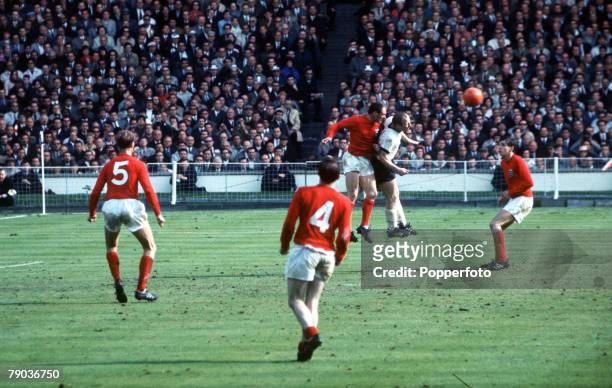 World Cup Final 30th July Wembley Stadium, England, England 4 v West Germany 2, England defender Ray Wilson jumps up to head the ball clear from West...