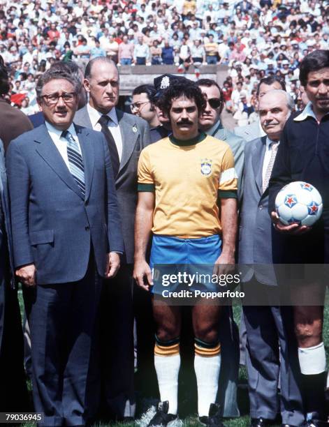 Football, Rivelino, one of the stars of the victorious Brazilian 1970 World Cup team lines up before an international match as he stands with US...
