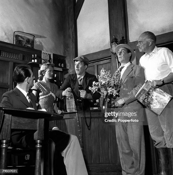 Cinema, England A scene from the film "Dry Rot", showing L-R: John Chapman, Diana Calderwood, Brian Rix, John Slater, and Charles Coleman