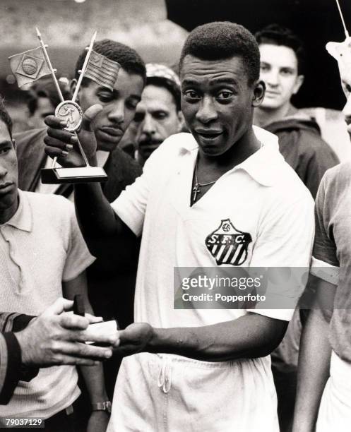 Sport, Football, January 1965, Brazil's Pele, pictured in his Santos club strip, receives another award, Pele was probably the most famous player...