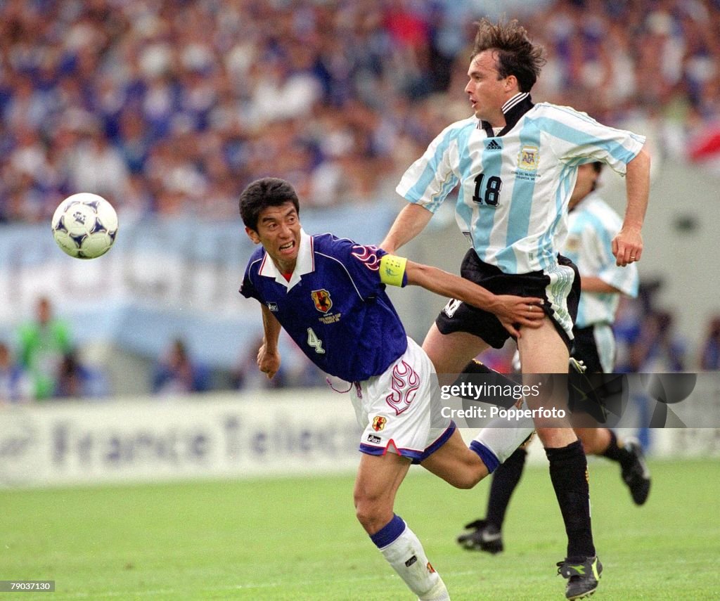 World Cup Finals, 1998. Toulouse, France. 14th June, 1998. Argentina 1 v Japan 0. Japan's Masami Ihara beaten to the ball by Argentina's Abel Balbo.