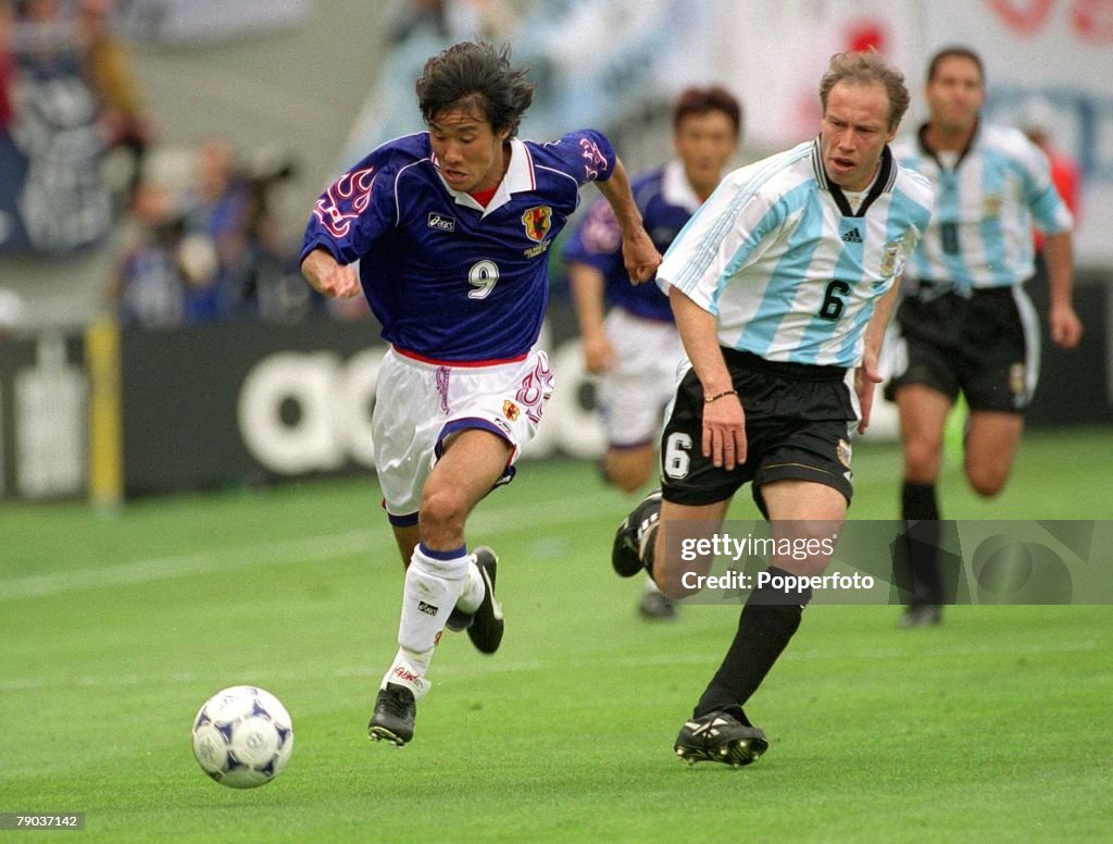 World Cup Finals, 1998. Toulouse, France. 14th June, 1998. Argentina 1 v Japan 0. Japan's Masashi Nakayama gets away from Argentina's Roberto Sensini.