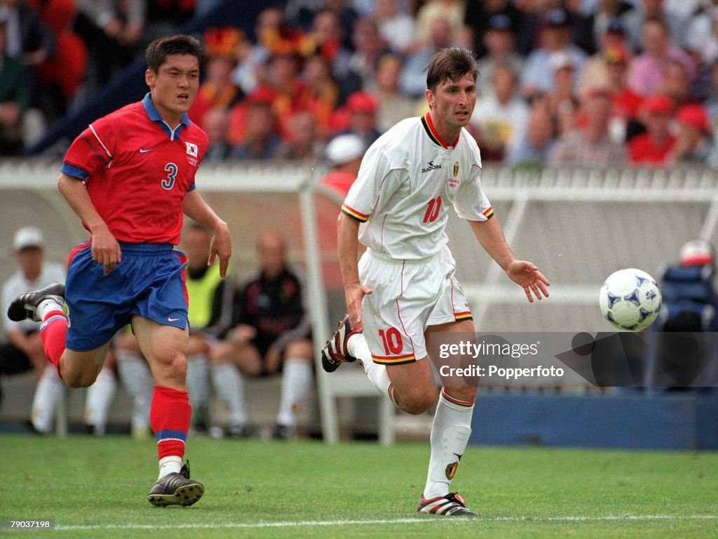 1998 World Cup Finals. Paris, France. 25th June, 1998. Belgium 1 v South Korea 1. Belgium's Luc Nilis with South Korea's Lim Saeng Lee.