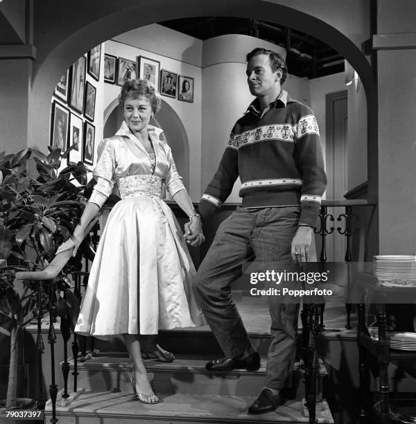 Cinema, England British actors Tony Britton and Glynis Johns are pictured in a scene from the film "Loser Takes All"