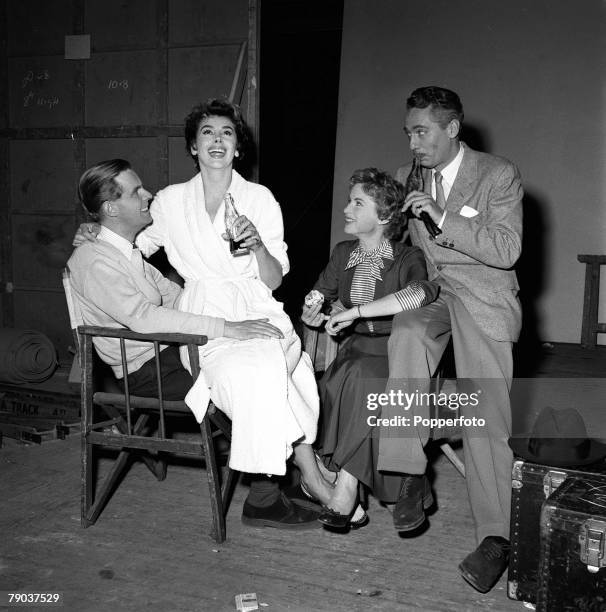 Cinema, England Actors L-R: Ian Carmichael, Kay Kendall, Murial Pavlow, and Peter Finch are pictured on the set of the film "Simon and Laura"