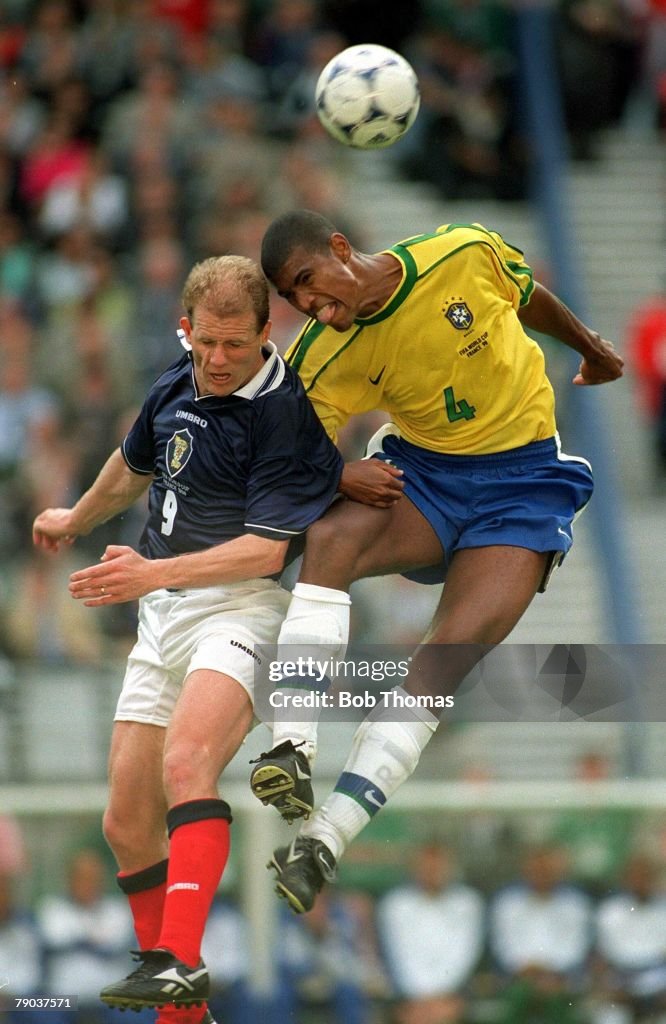 1998 World Cup Finals. St Denis. Paris. 10th June, 1998. Brazil 2 v Scotland 1. Scotland's Gordon Durie in mid-air battle with Brazil's Junior Baiano.