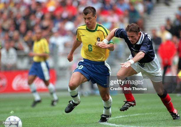 World Cup Finals, St Denis, Paris, 10th June Brazil 2 v Scotland 1, Brazilian captain Dunga fights for the ball with Scotland's Kevin Gallacher