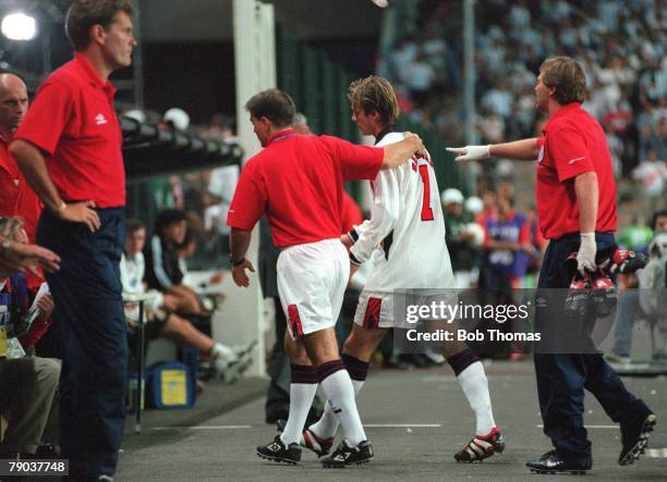 World Cup 1998 Finals, St, Etienne, France, 30th June England 2 v Argentina 2 , England's David Beckham walks past coach Glenn Hoddle after he was...