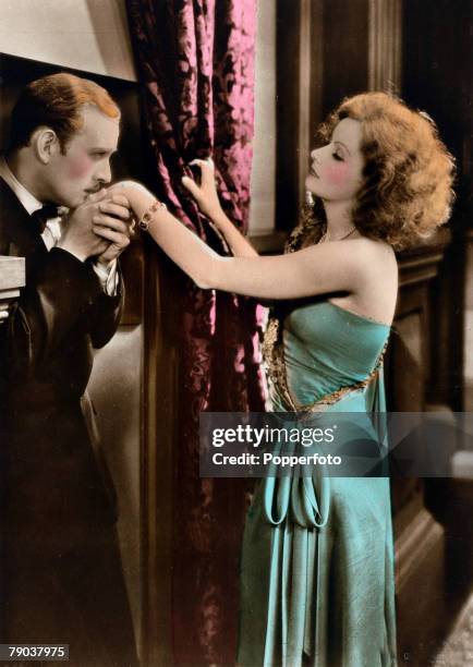 Cinema, Personalities, circa 1930+s, Swedish born film actress Greta Garbo, born Stockholm 1905, pictured in a love scene with actor Conrad Nagel,...