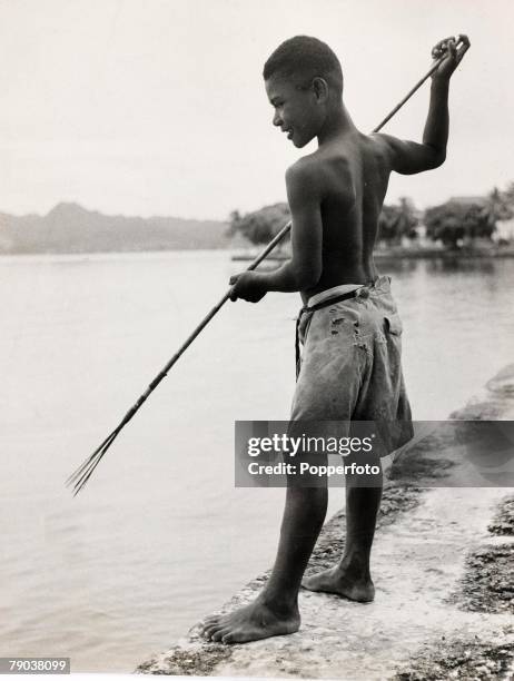 Popperfoto via Getty Images,The Book, Volume 1,Page: 93, Picture: 2, Young fisherman with a spear rod, Fiji