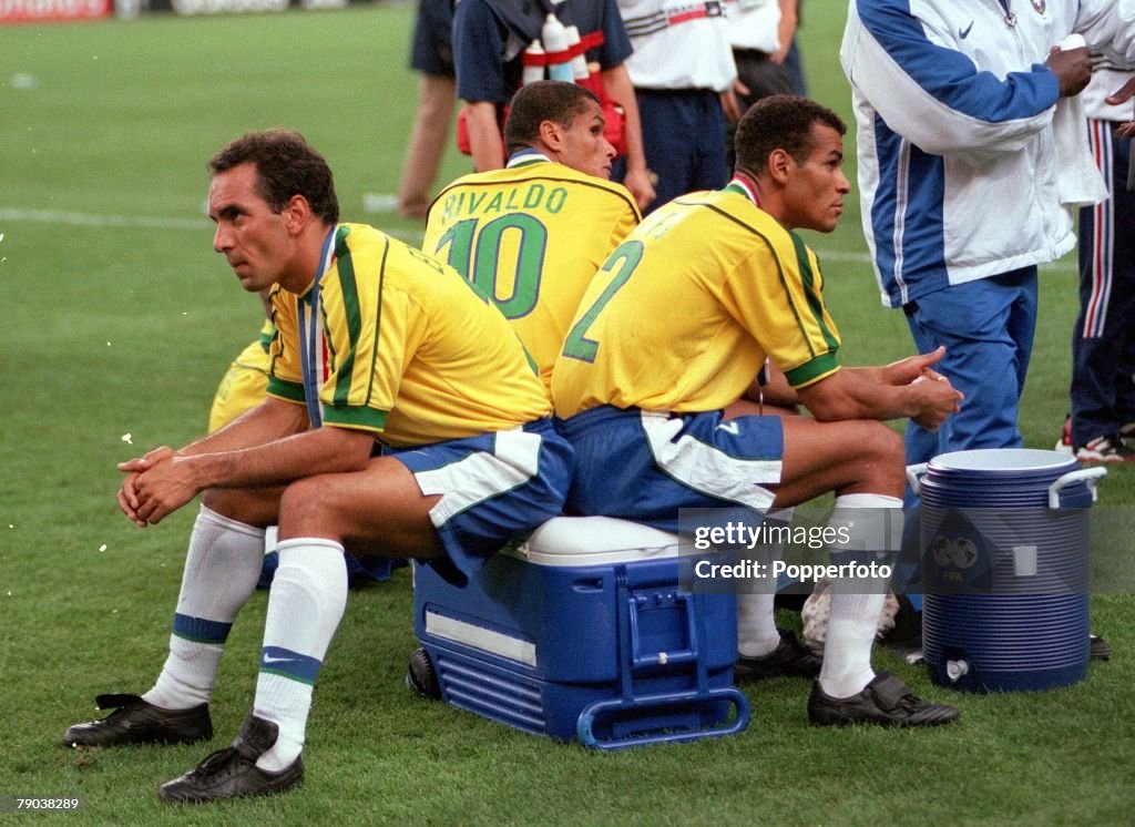 1998 World Cup Final. St. Denis, France. 12th July, 1998. France 3 v Brazil 0. Brazilians Edmundo (L), Rivaldo (C) and Cafu sit dejected after the match.