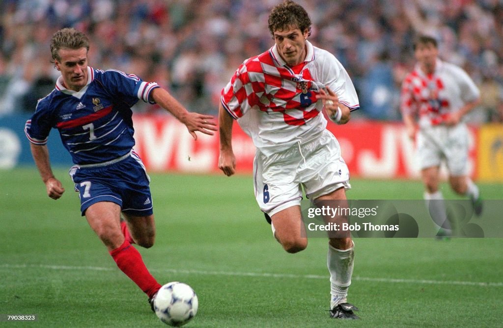 1998 World Cup Finals. St. Denis, France. Semi-Final. 8th July, 1998. France 2 v Croatia 1. Croatia's Slaven Bilic fights for the ball with France's Didier Deschamps.
