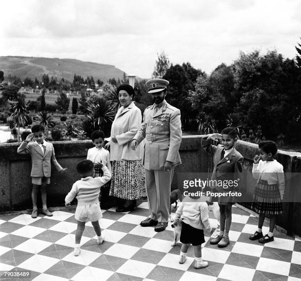 Addis Ababa, Ethiopia, Africa Emperor Haile Selassie and his wife are pictured with the children of the Duke of Harar and of the Crown Prince on the...