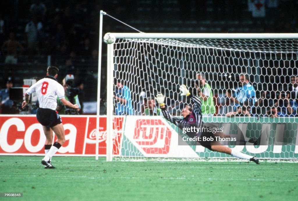 1990 World Cup Semi Final. Turin, Italy. 4th July, 1990. West Germany 1 v England 1 (West Germany win 4-3 on penalties). England's Chris Waddle fires his penalty over the bar past the dive of West German goalkeeper Bodo Illgner in the shoot -out. The pena