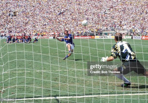 Brazil goalkeeper Claudio Taffarel dives as Italy's Franco Baresi takes his side's first penalty and misses in the penalty shoot-out in the 1994 FIFA...