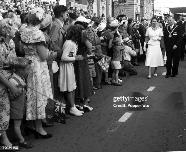 Royal Tour of New Zealand 19 January 1954: Queen Elizabeth II of the United Kingdom takes a walk along the length of Broadway Stratford where...