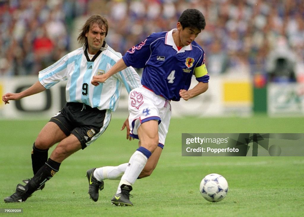 1998 World Cup Finals. Toulouse, France. 14th June, 1998. Argentina 1 v Japan 0. Japan's Masami Ihara turns away from Argentina's Gabriel Batistuta.