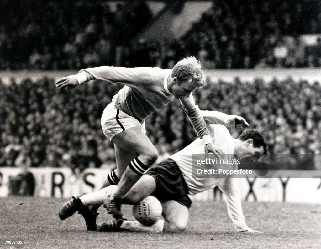 Sport. Football. League Division One. White Hart Lane, London, England. 4th May 1968. Tottenham Hotspur v Manchester City. Manchester City's Francis Lee is stopped as Tottenham Hotspur's Alan Mullery slides in to rob him of the ball.